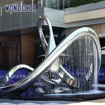 Large geometric circular fountain stainless steel sculpture in the square