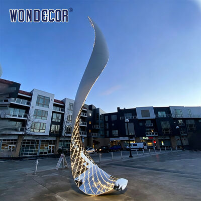Large outdoor stainless steel lighting sculpture with curved shape