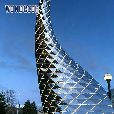 Large outdoor stainless steel lighting sculpture with curved shape
